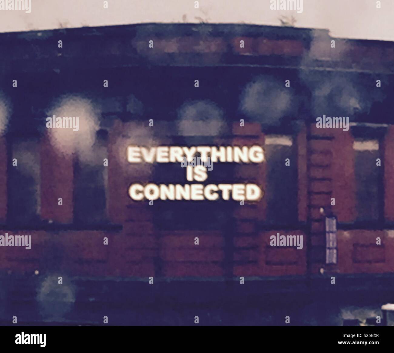 Illuminated sign through rainy window - Smartphone Captured Stock Image Illuminated sign through rainy window - Smartphone Captured Stock Image