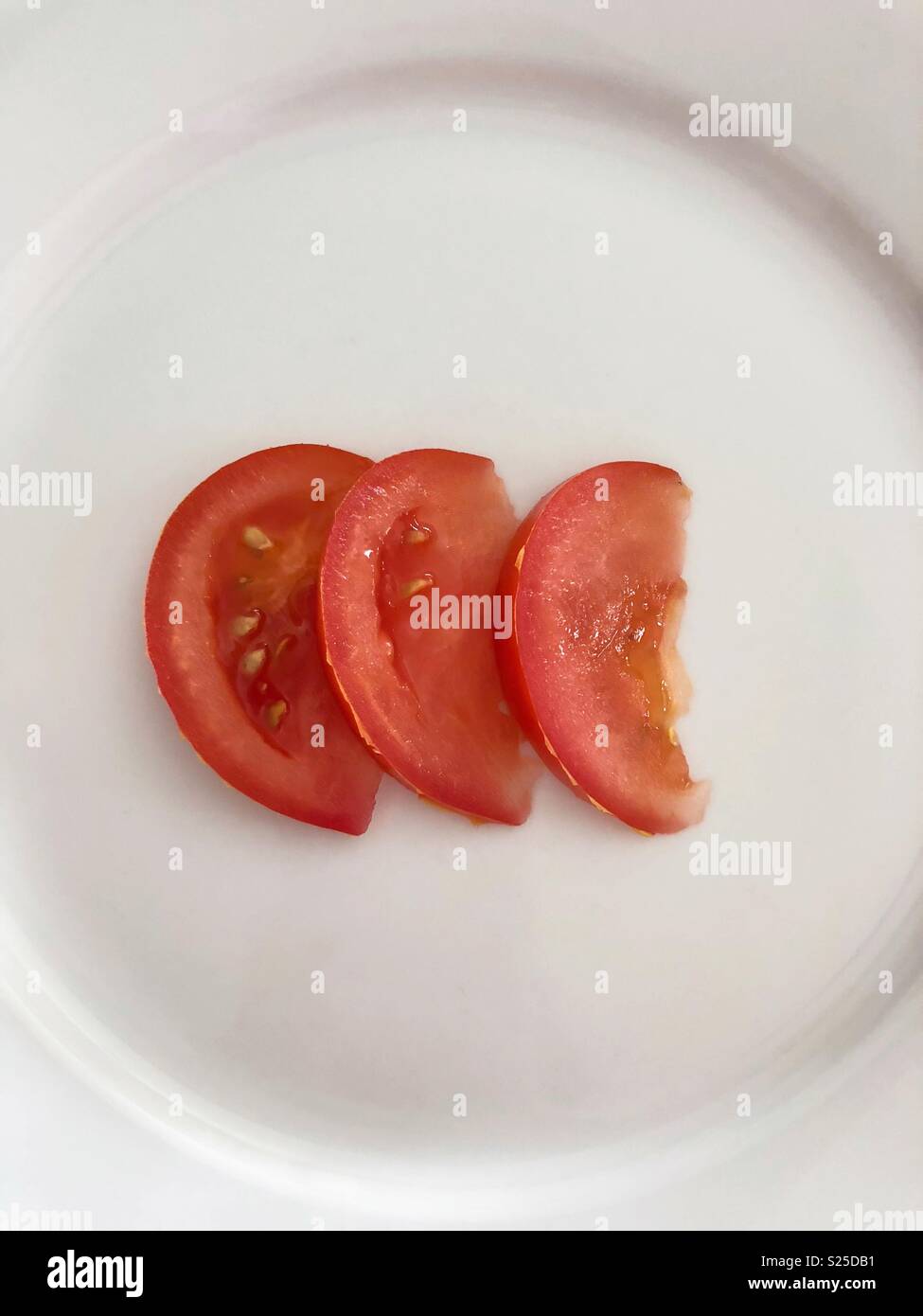 Three red tomato slices - Smartphone Captured Stock Image