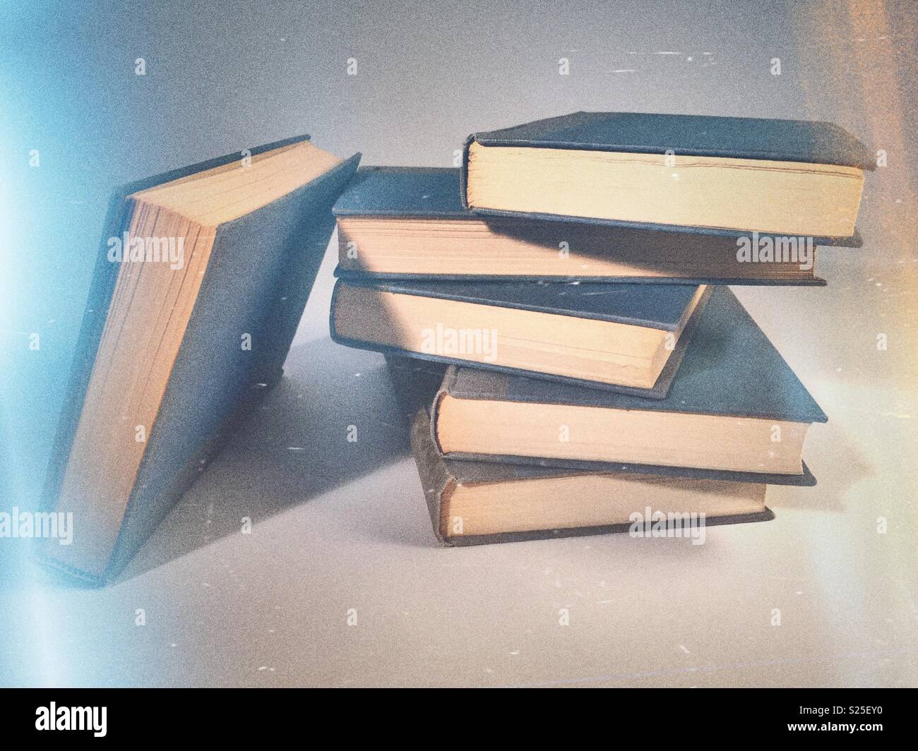 Close up of a stack of vintage hardbound books - Smartphone Captured Stock Image