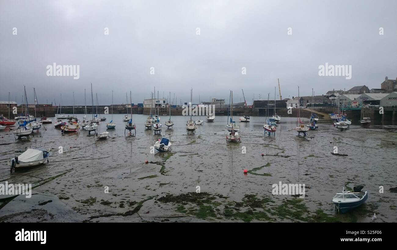 Boats resting at low tide in Penzance harbour, Cornwall Stock Photo Alamy