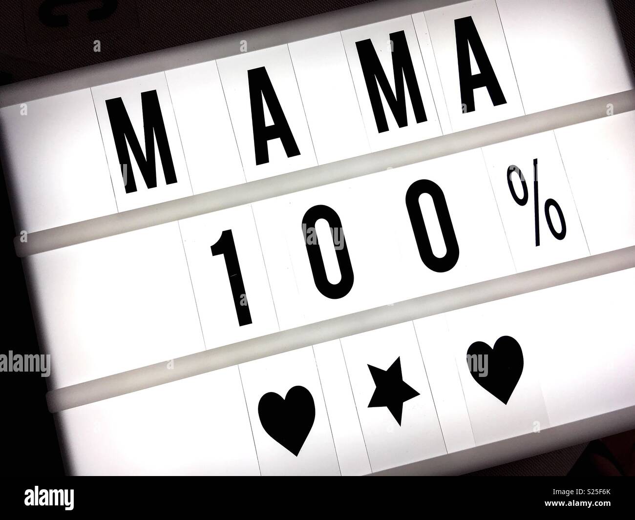 Mama spelled out in capital letters on a lightbox Stock Photo