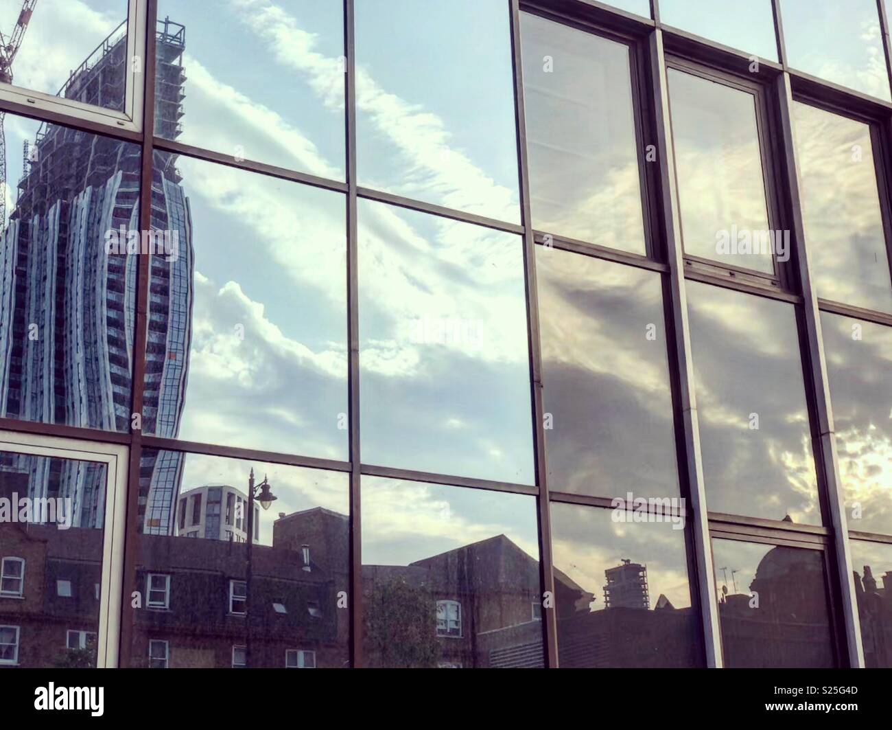 Reflections in a London building at sunset Stock Photo