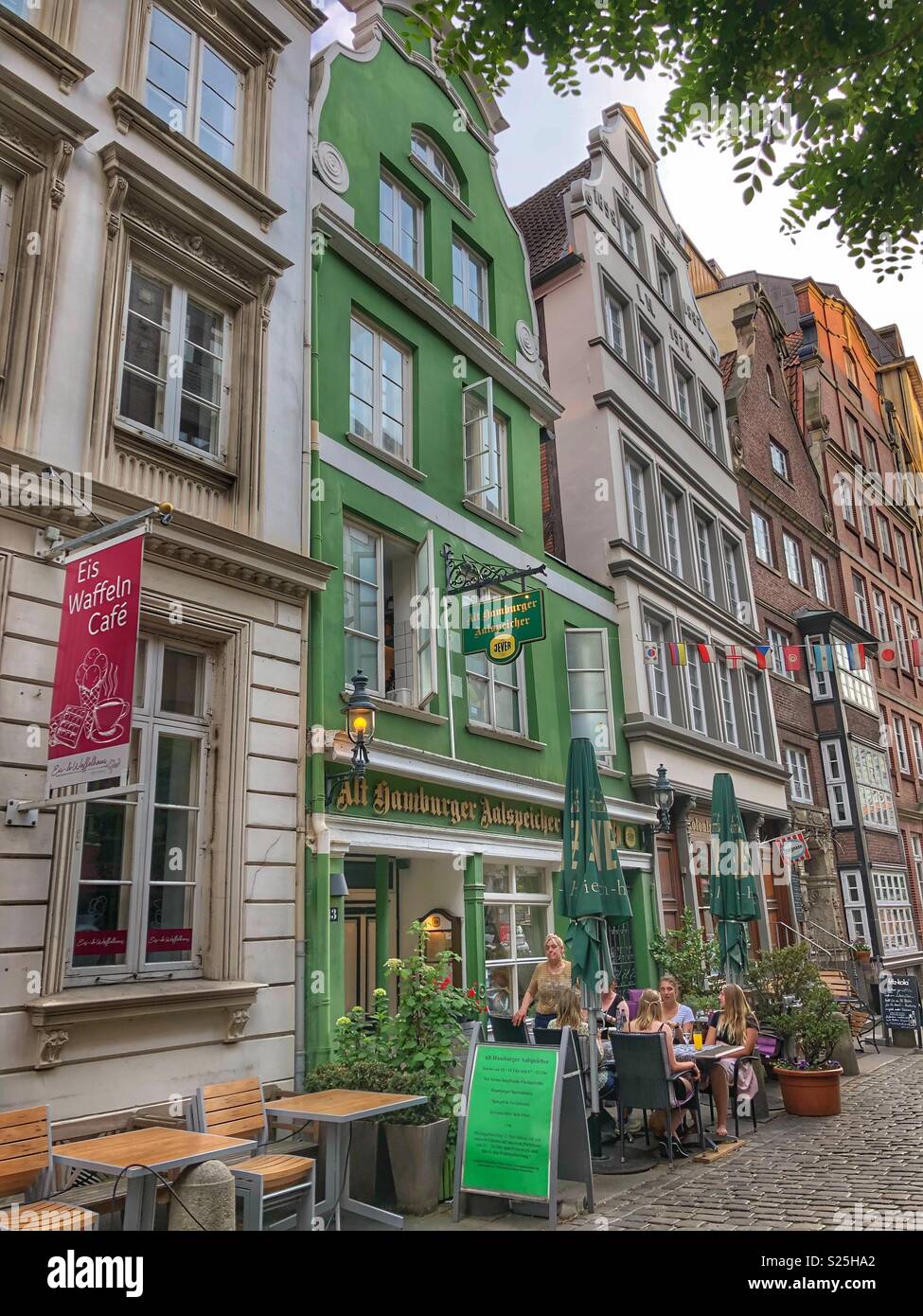 Deichstrasse in Hamburg, Germany, a cobblestone street with old historic buildings. - Smartphone Captured Stock Image