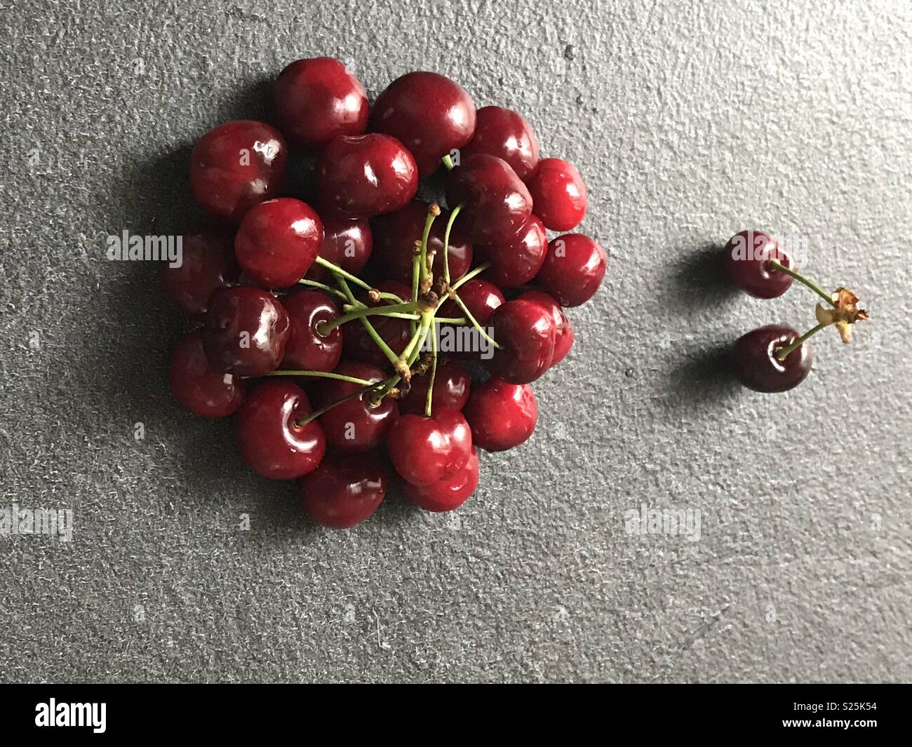 Discrimination metaphors using cherries and their different colored Stock Photo