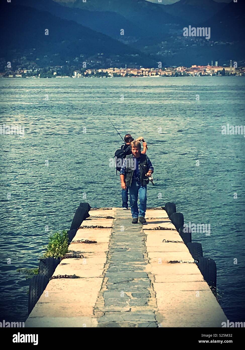 Men fishing on Lake Maggiore at Stresa, Italy. - Smartphone Captured Stock Image
