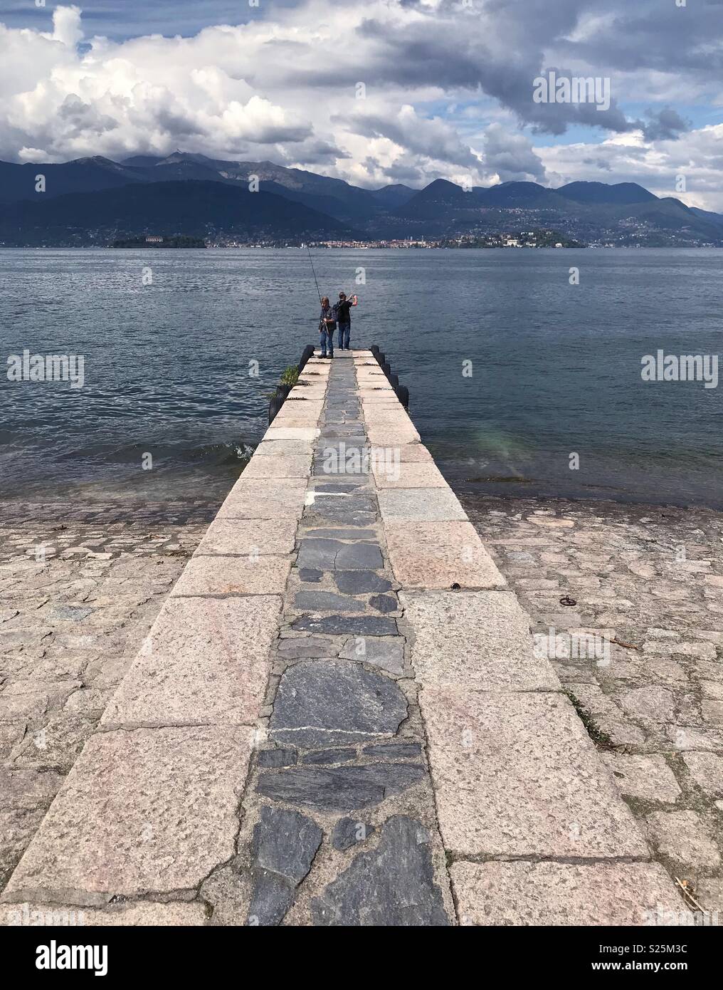 Men fishing on Lake Maggiore at Stresa, Italy. - Smartphone Captured Stock Image