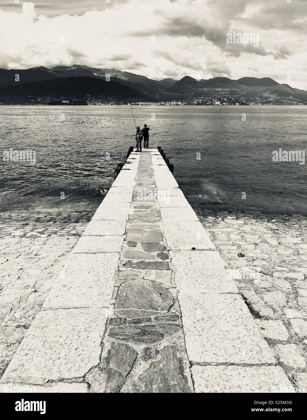 Men fishing on Lake Maggiore at Stresa, Italy. - Smartphone Captured Stock Image