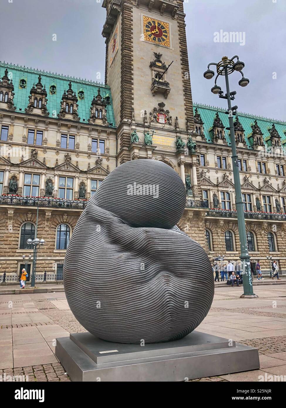 Embryo sculpture, Unlimited Life, created by Taiwanese artist Kang Mu-Xiang, stands in Hamburg’s Central Square, Rathausmarkt. Stock Photo