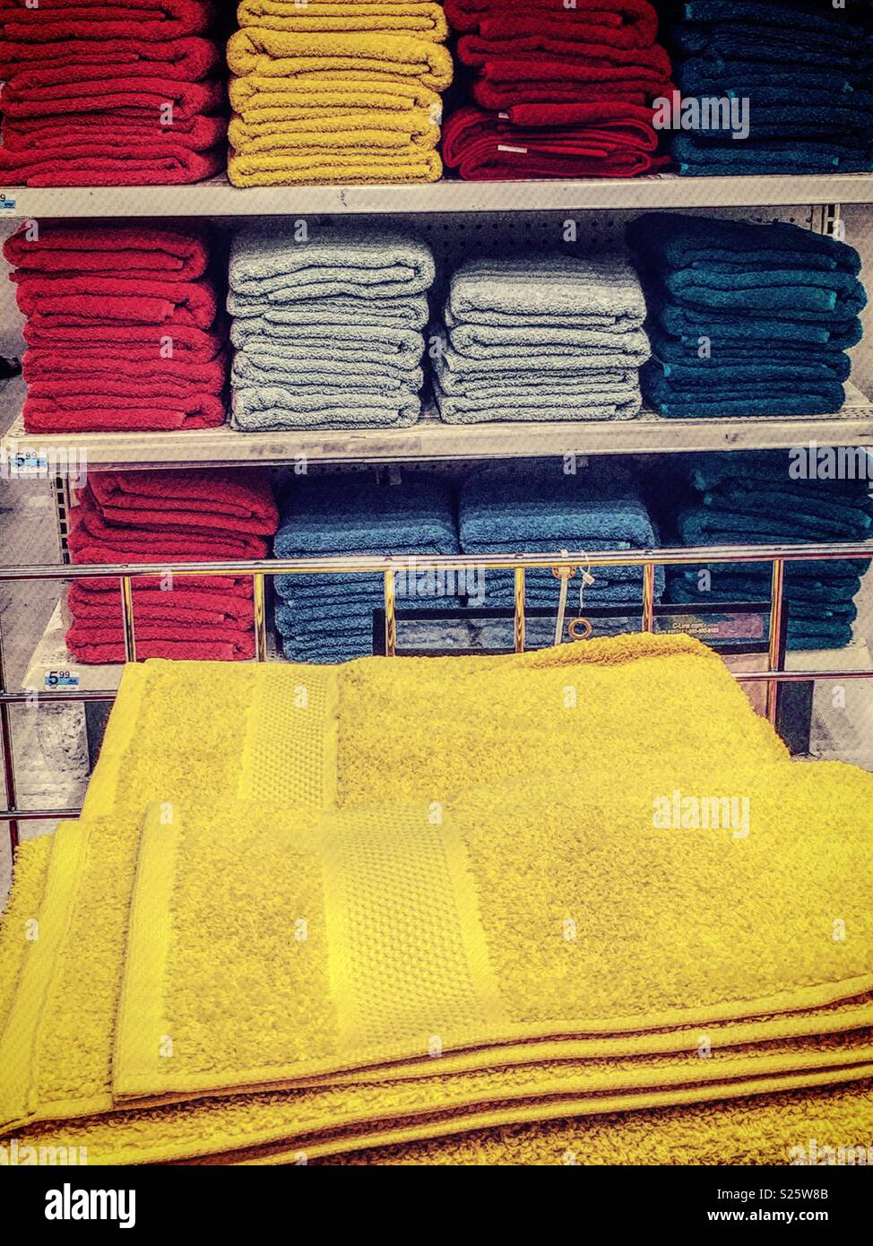 Brightly colored towels for sale in a big box store, United States - Smartphone Captured Stock Image