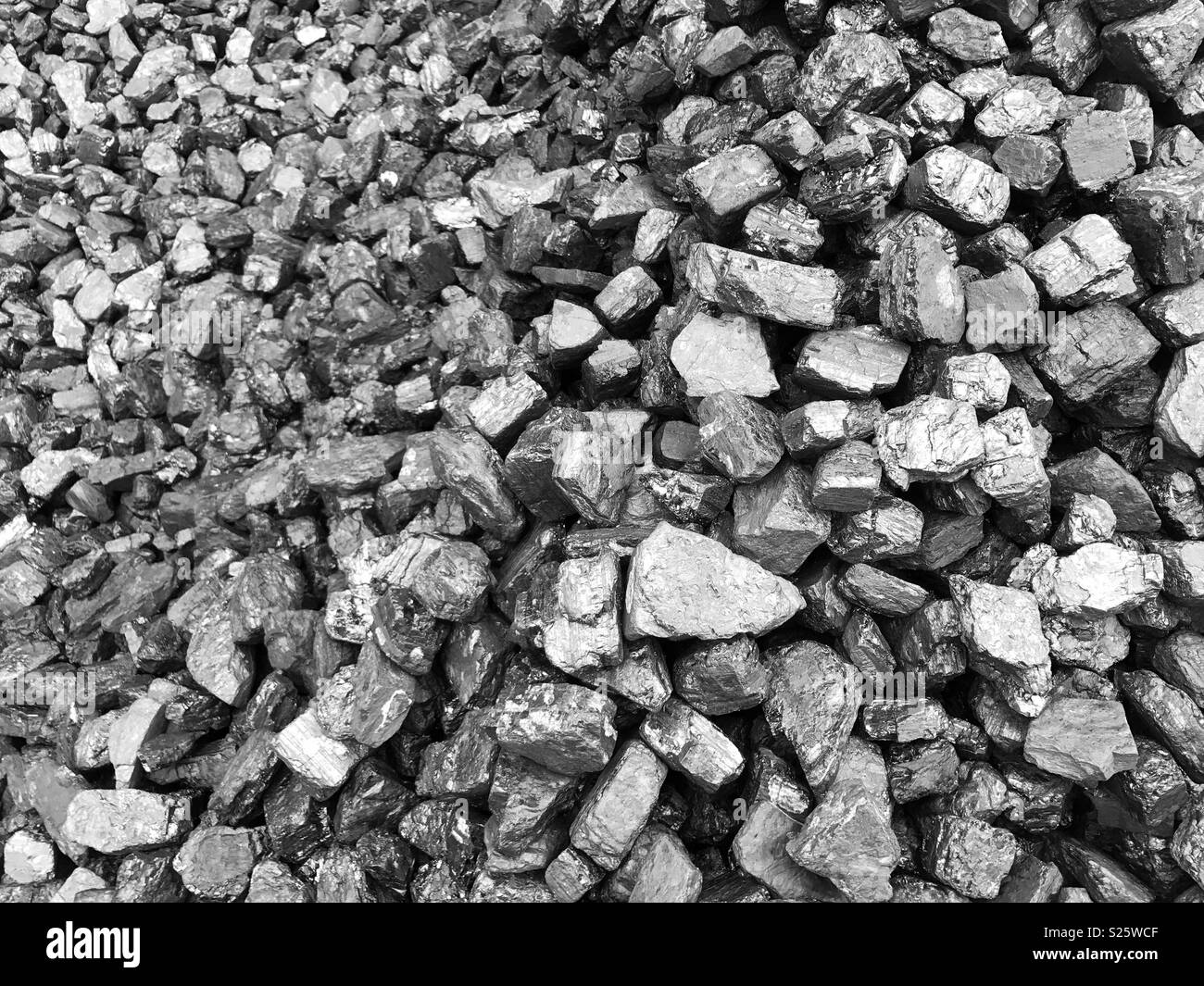 A pile of coal. Lumps of coal, a fossil fuel used to generate heat and electricity. Stock Photo