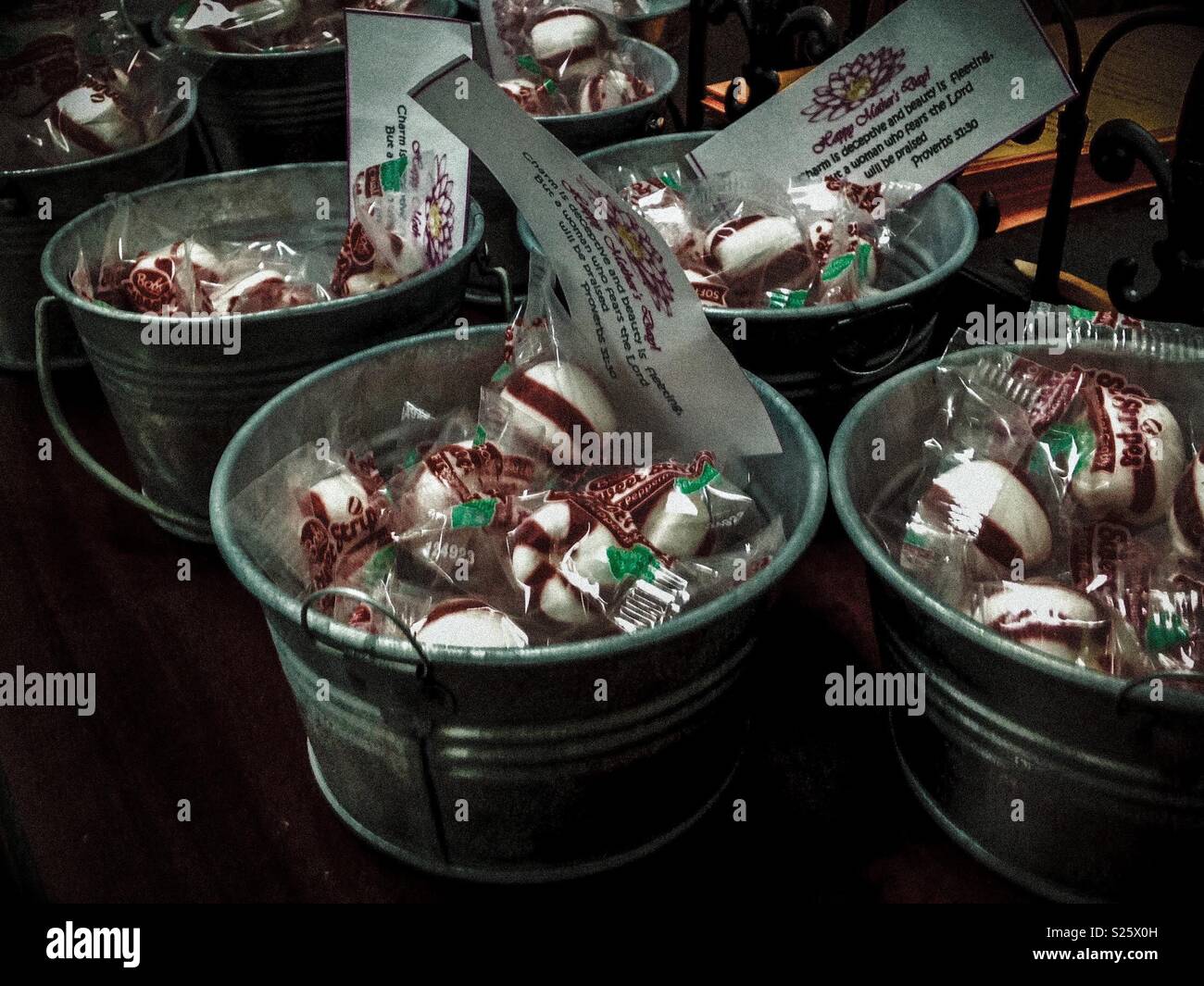 Mother's Day treats inside decorative buckets offered to all women at local church - Smartphone Captured Stock Image