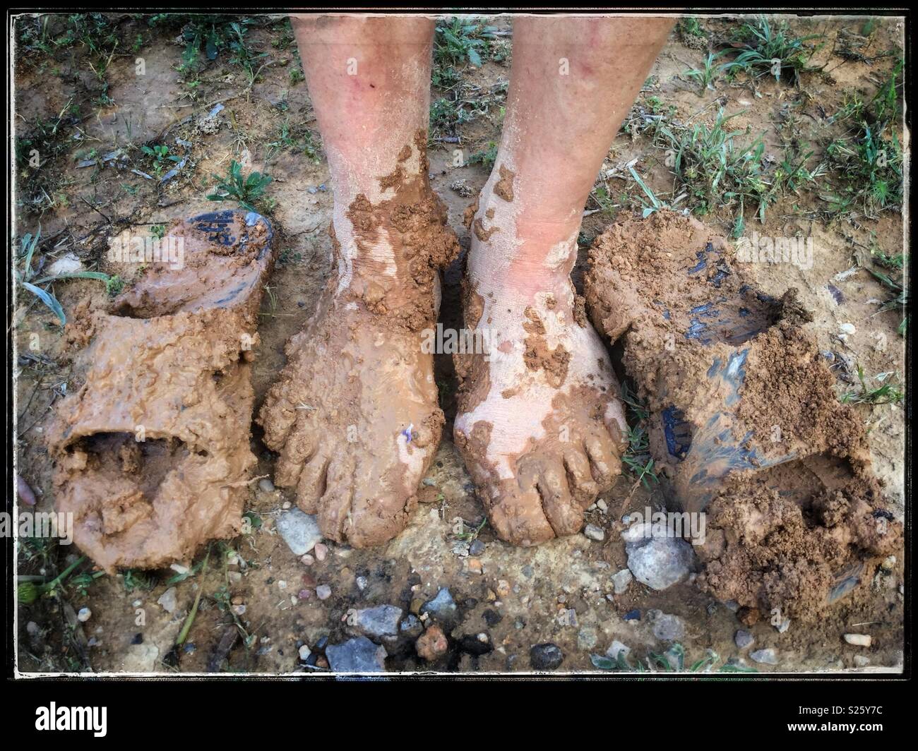 Muddy feet and flip-flops, Catalonia, Spain. - Smartphone Captured Stock Image