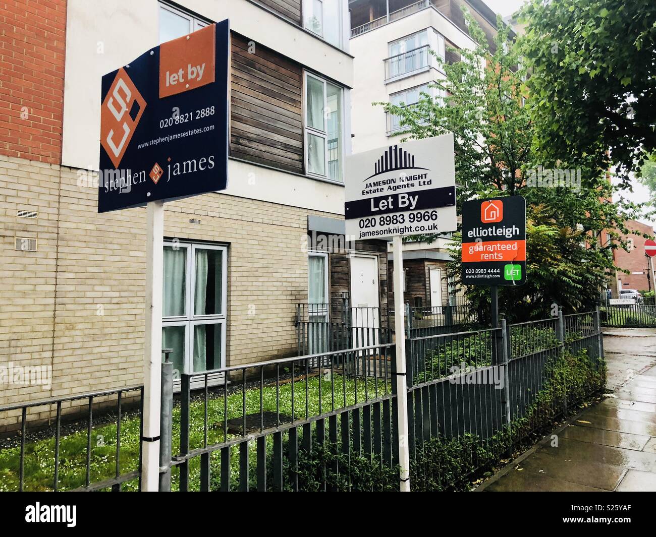 Estate agents signs in Bow, East London Stock Photo Alamy