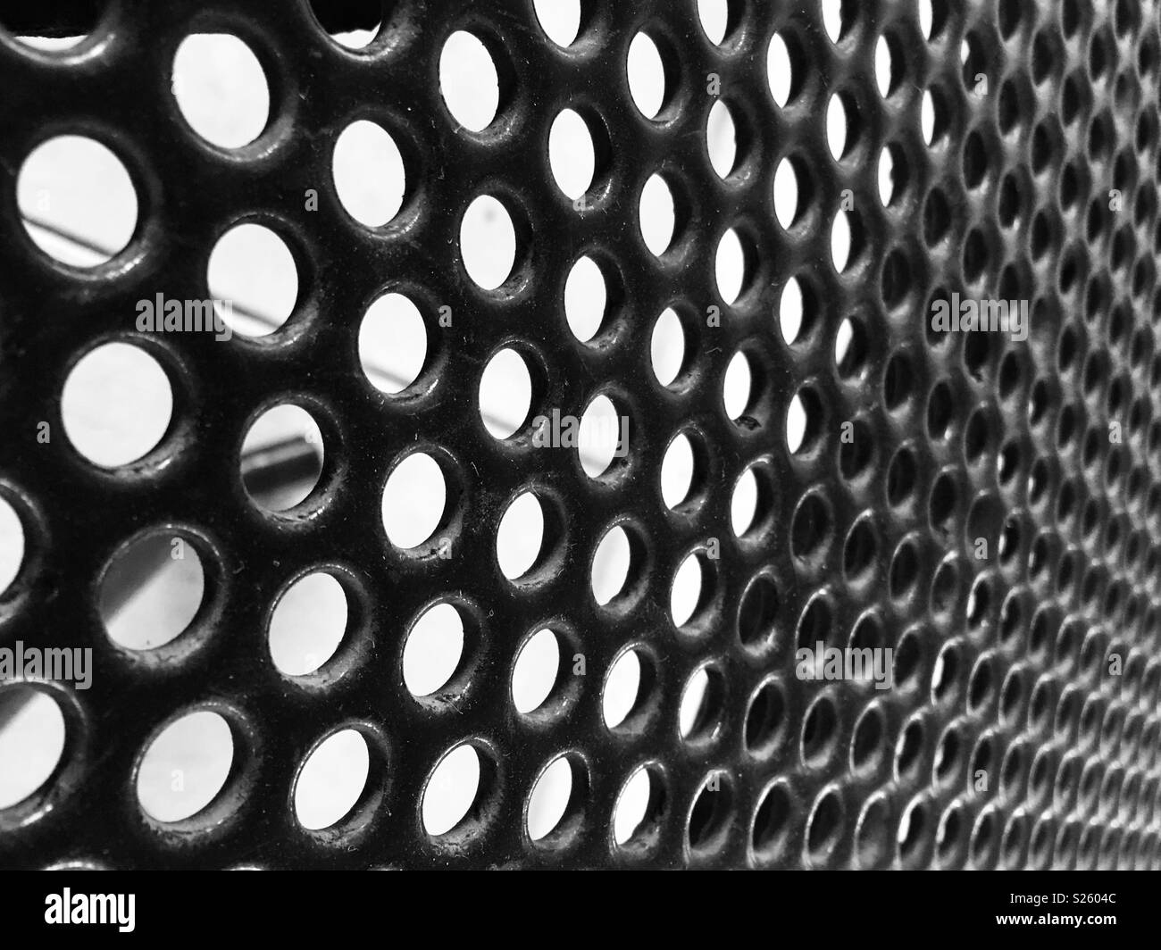 Black metal texture holes hi-res stock photography and images - Alamy