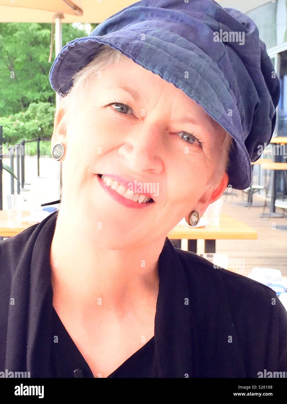 Smiling stylish senior woman, USA - Smartphone Captured Stock Image