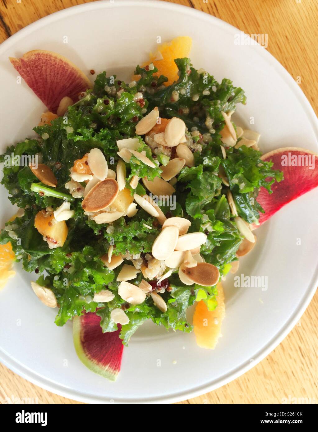 A kale and quinoa entrée salad at a restaurant, New York City, USA - Smartphone Captured Stock Image