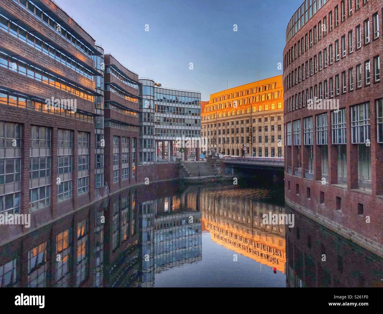 Historic buildings reflected in a canal in Hamburg, Germany. - Smartphone Captured Stock Image