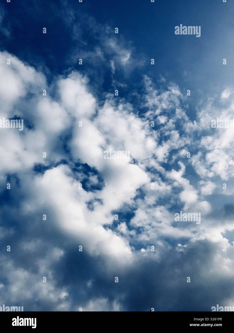 Dramatic deep blue sky with clouds - Smartphone Captured Stock Image