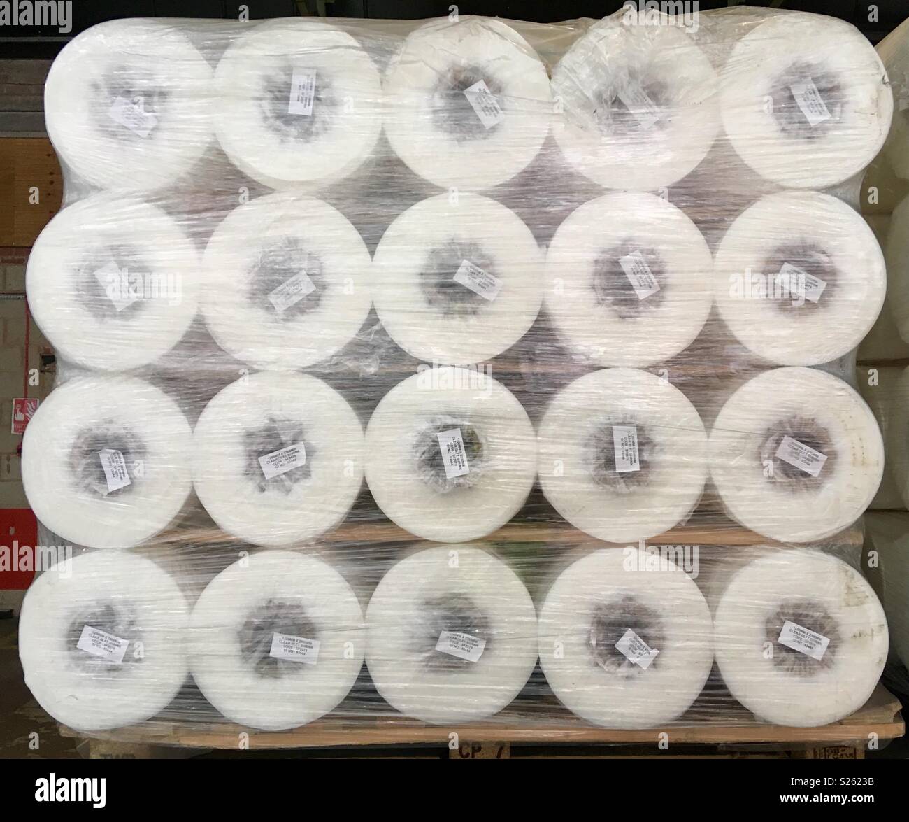 Shrinkwrapped pallet of rolls of shrinkwrap in a warehouse Stock Photo