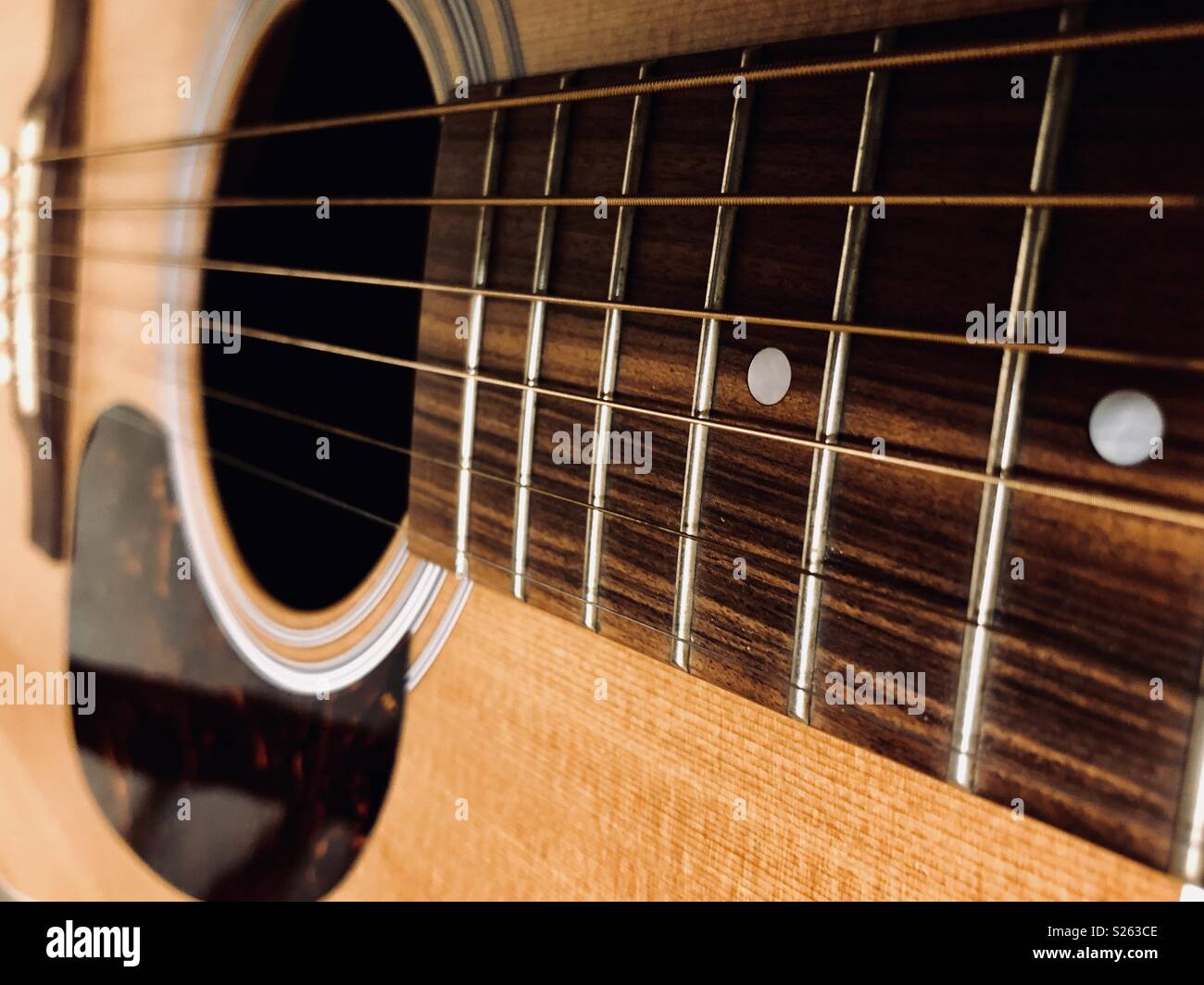 Close up of an acoustic guitar Stock Photo