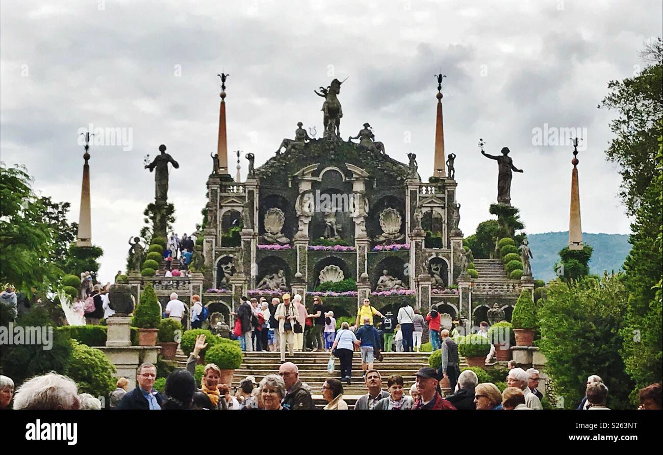 Crowd of tourists at the palace gardens at Isola Bella, one of the Borromean Islands of Italy. Stock Photo