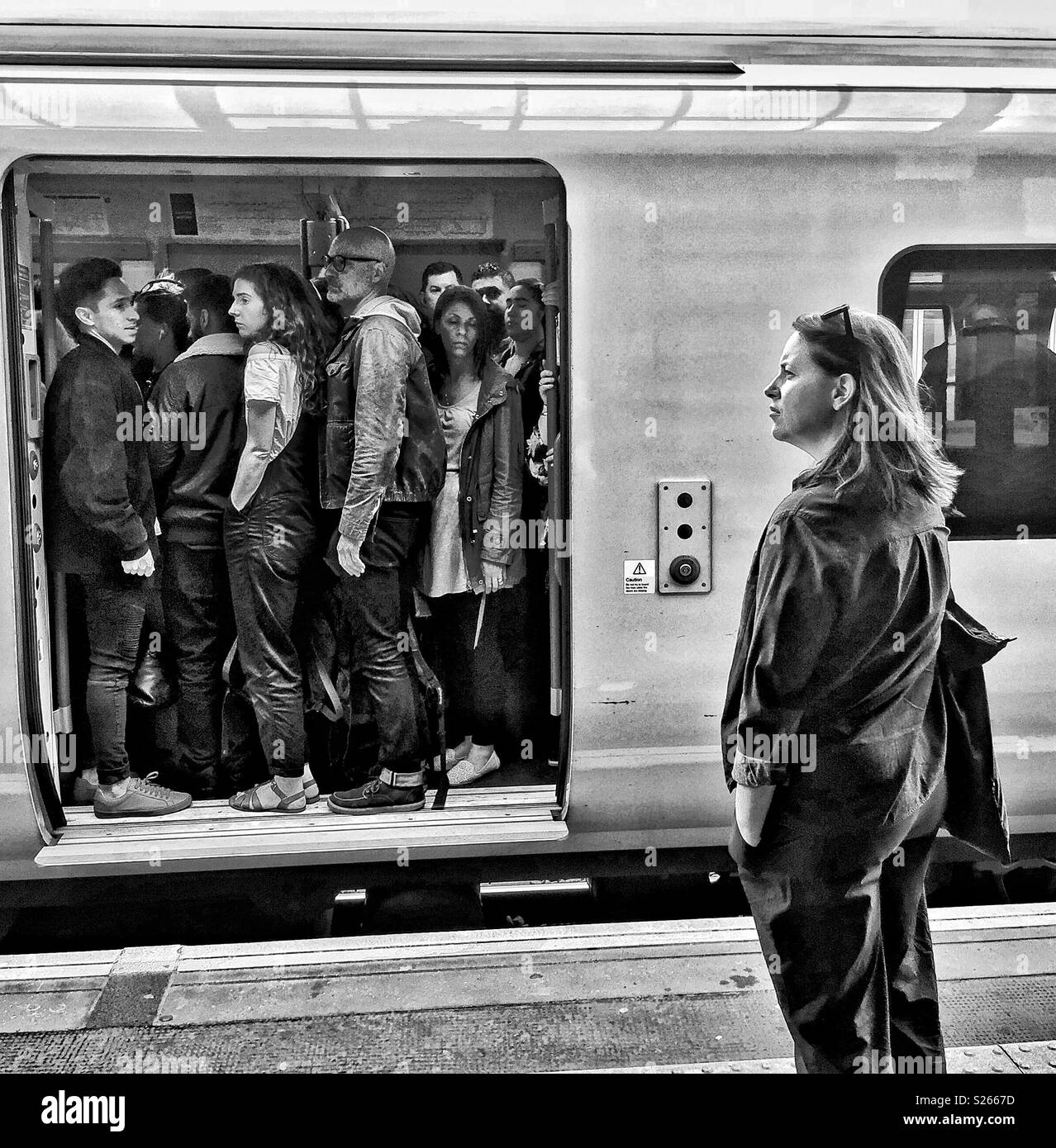 Commuters on a train. - Smartphone Captured Stock Image