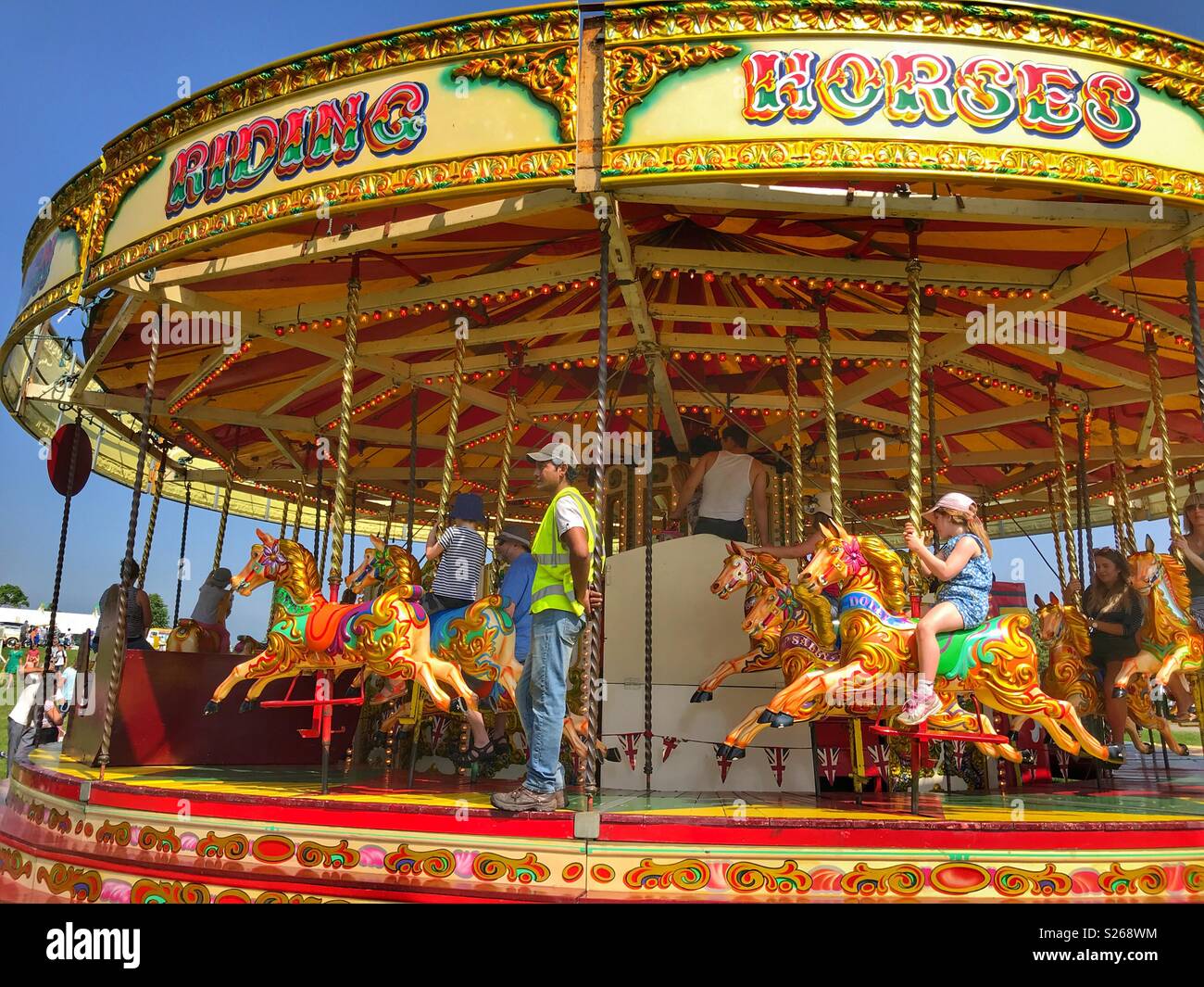 Fairground rides, merry-go-round at Sherborne Castle Country Fair, Sherborne, Dorset, England - Smartphone Captured Stock Image