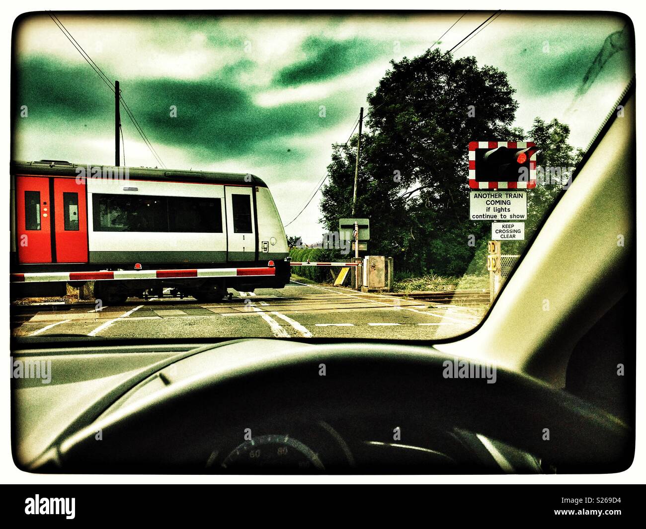 Level crossing on the East Suffolk branch line, Yoxford, Suffolk, England. - Smartphone Captured Stock Image
