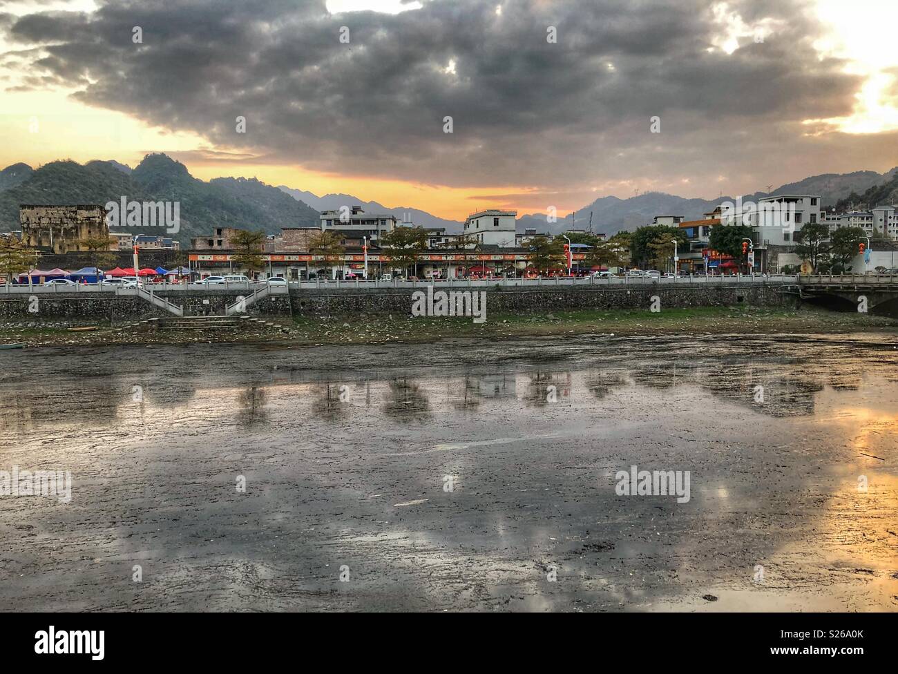 Clouds, sunset and water reflections in Southern China. - Smartphone Captured Stock Image
