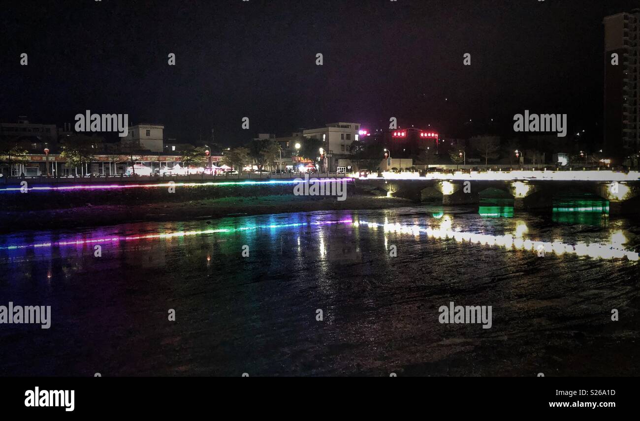 Brightly lit riverbank in Guangdong Province, Southern China. - Smartphone Captured Stock Image