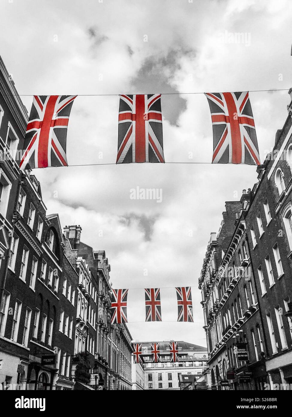Union Jacks suspended in the air at Covent Garden, in London Stock Photo