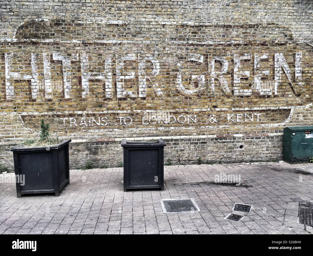 Hither Green written on the wall of god train station in London, England - Smartphone Captured Stock Image