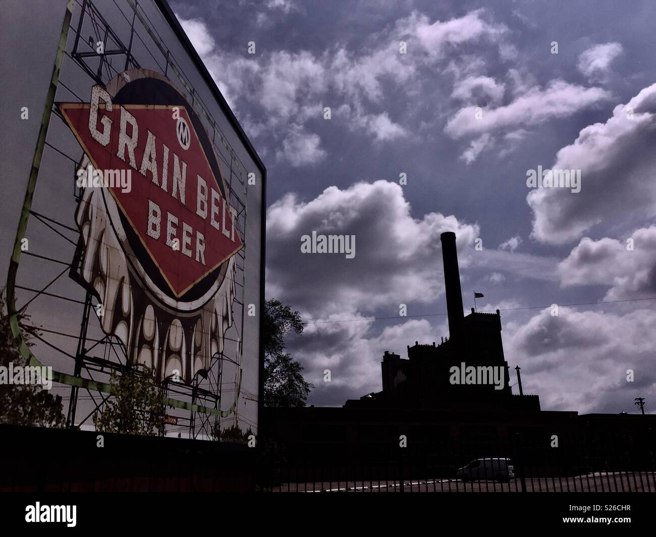 Vintage billboard with the old Schmidt Brewery, now artist lofts, in the background, St. Paul, Minnesota, USA. Stock Photo