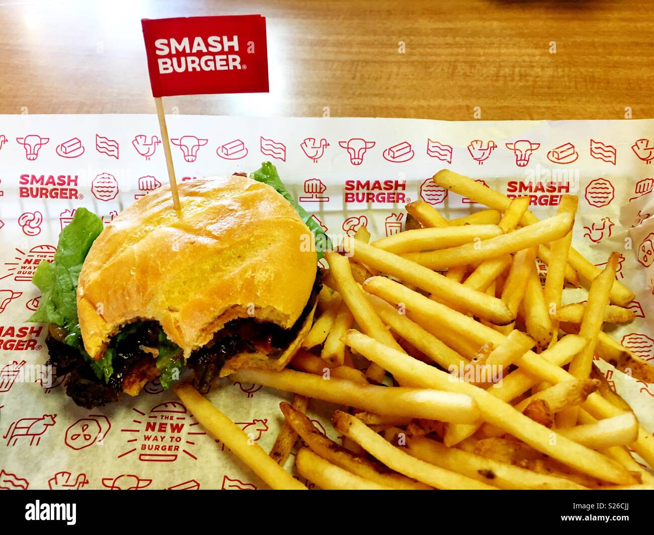 Eating a black bean burger at SmashBurger in California Stock Photo Alamy