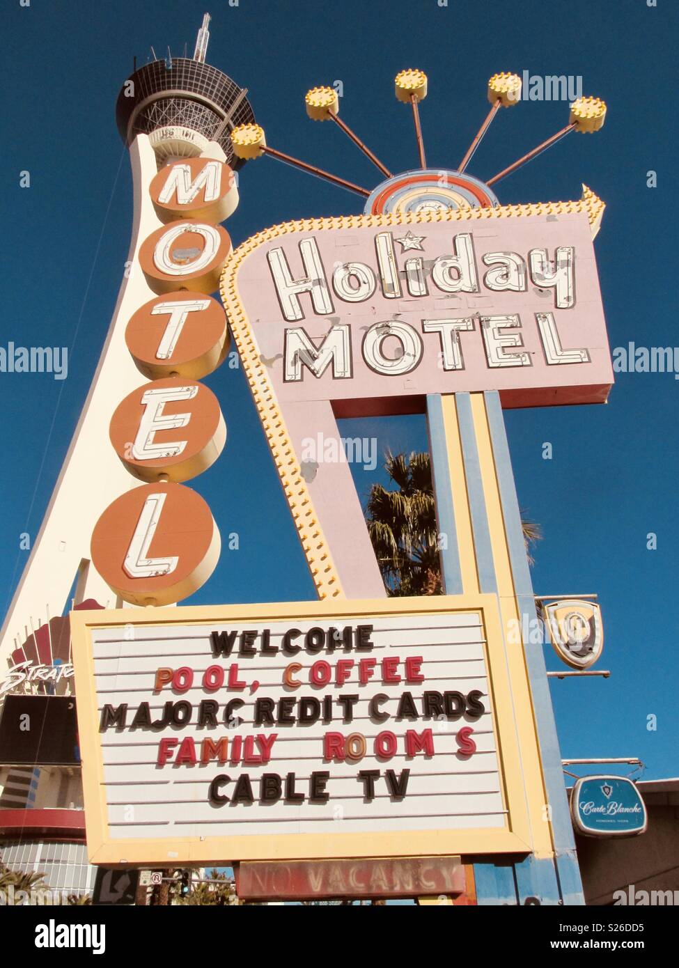 Stratosphere Hotel Behind Holiday Motel Sign On The Las Vegas Strip Stock Photo Alamy