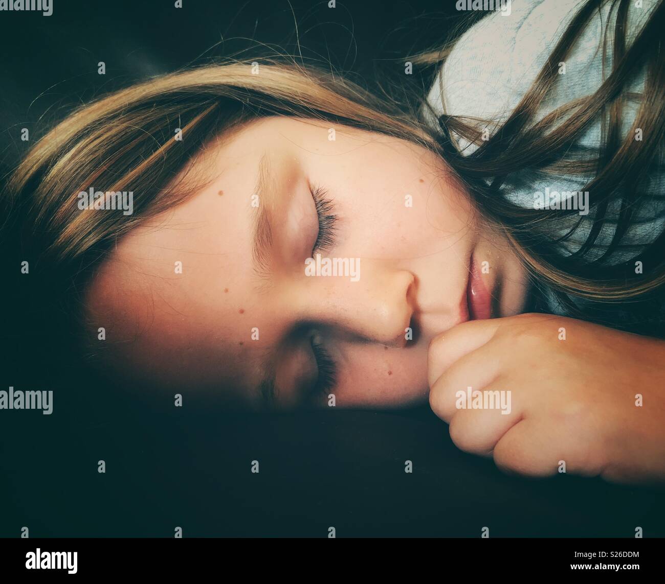 Sleeping 5 year old girl closeup portrait - Smartphone Captured Stock Image