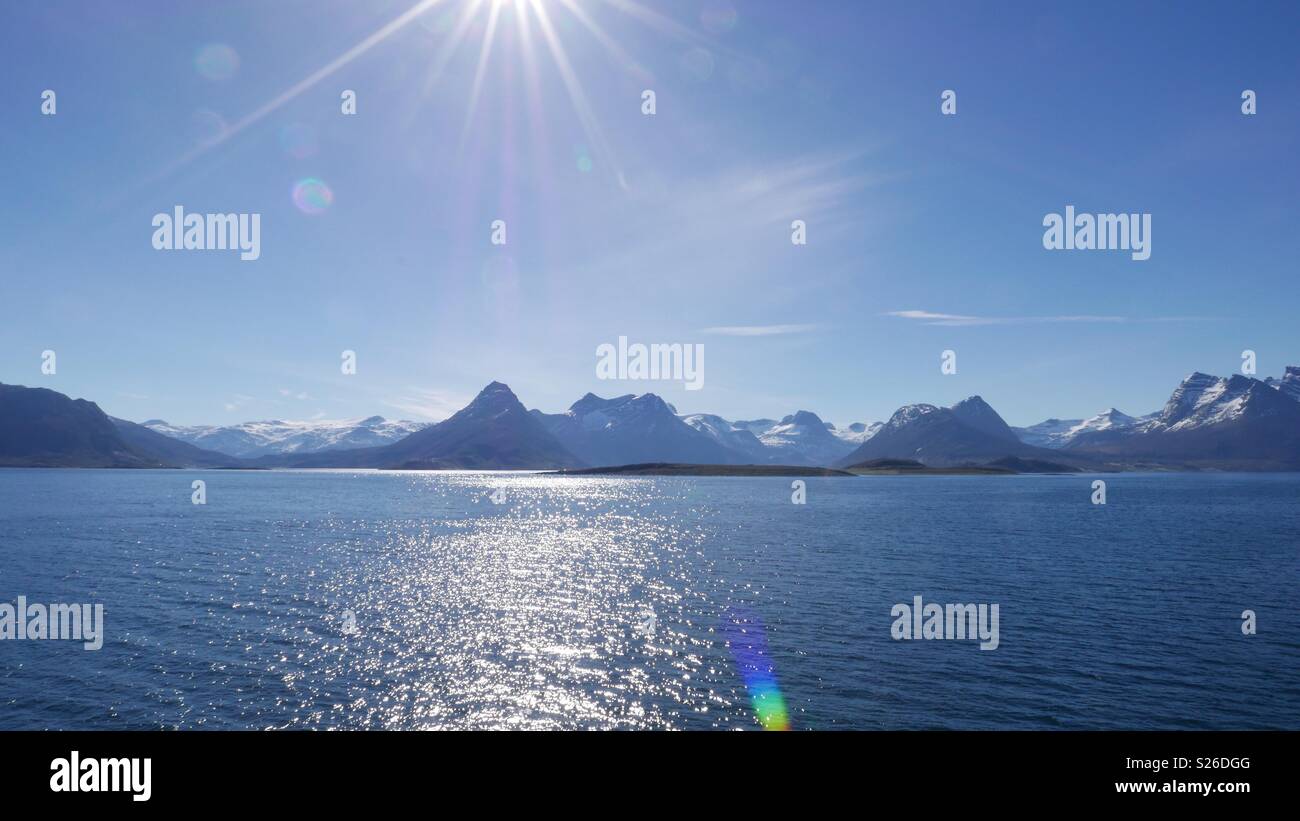 Sunlight flare over the Norwegian fjords - Smartphone Captured Stock Image