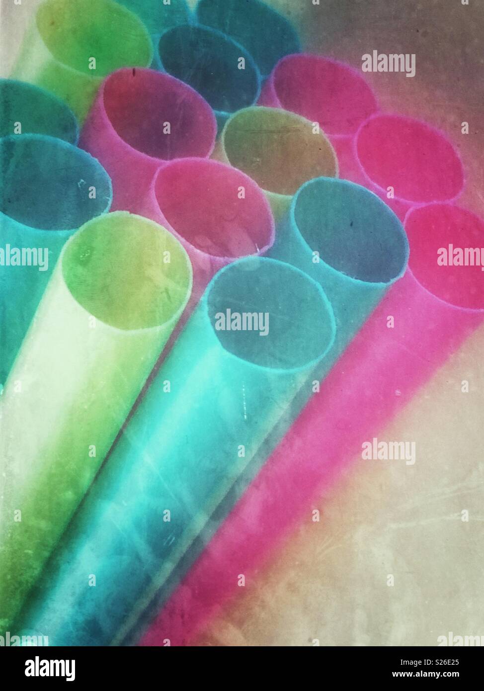 Closeup image of coloured plastic drinking straws with a foggy grunge effect Stock Photo