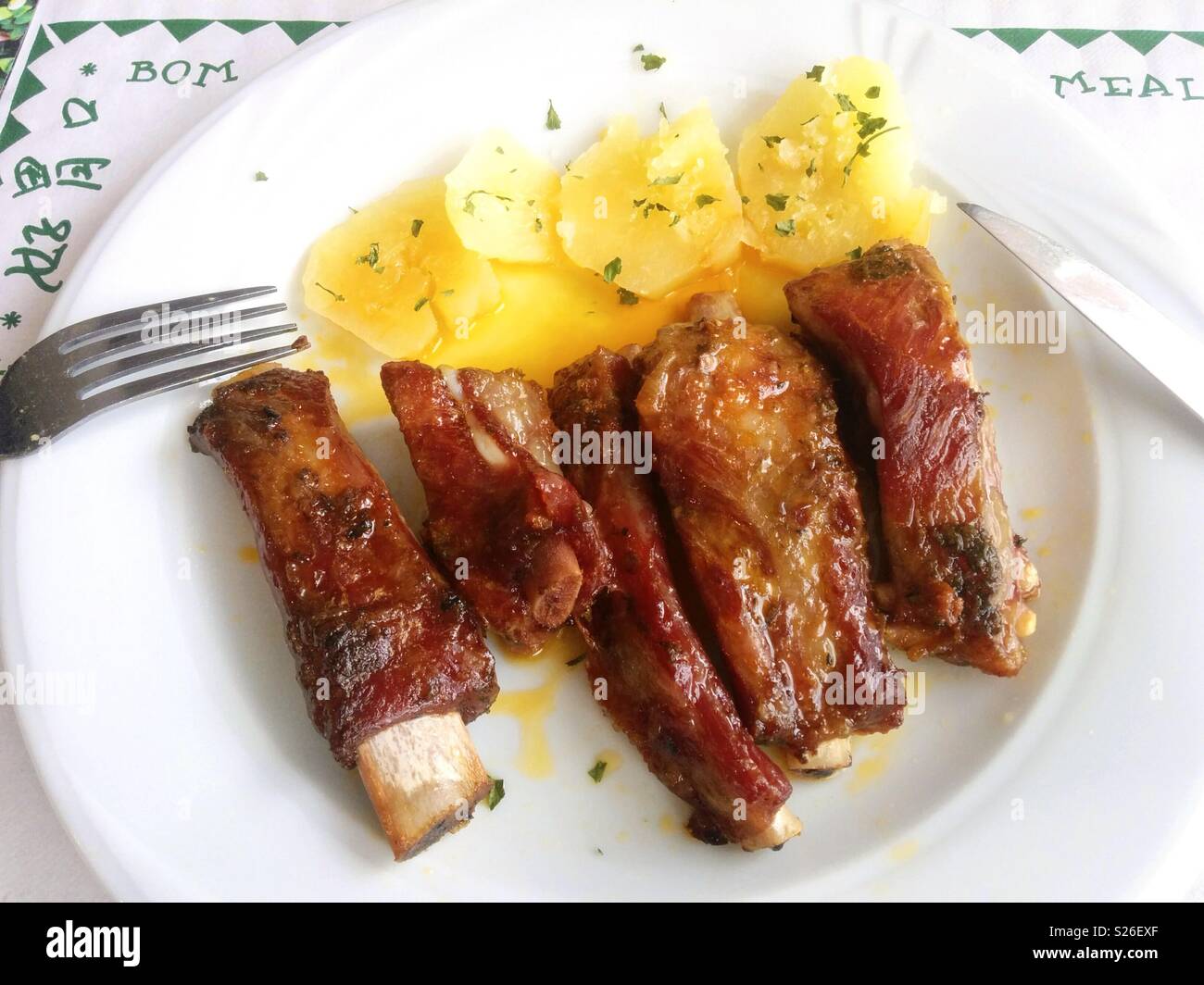 Pork ribs with potatoes. Stock Photo