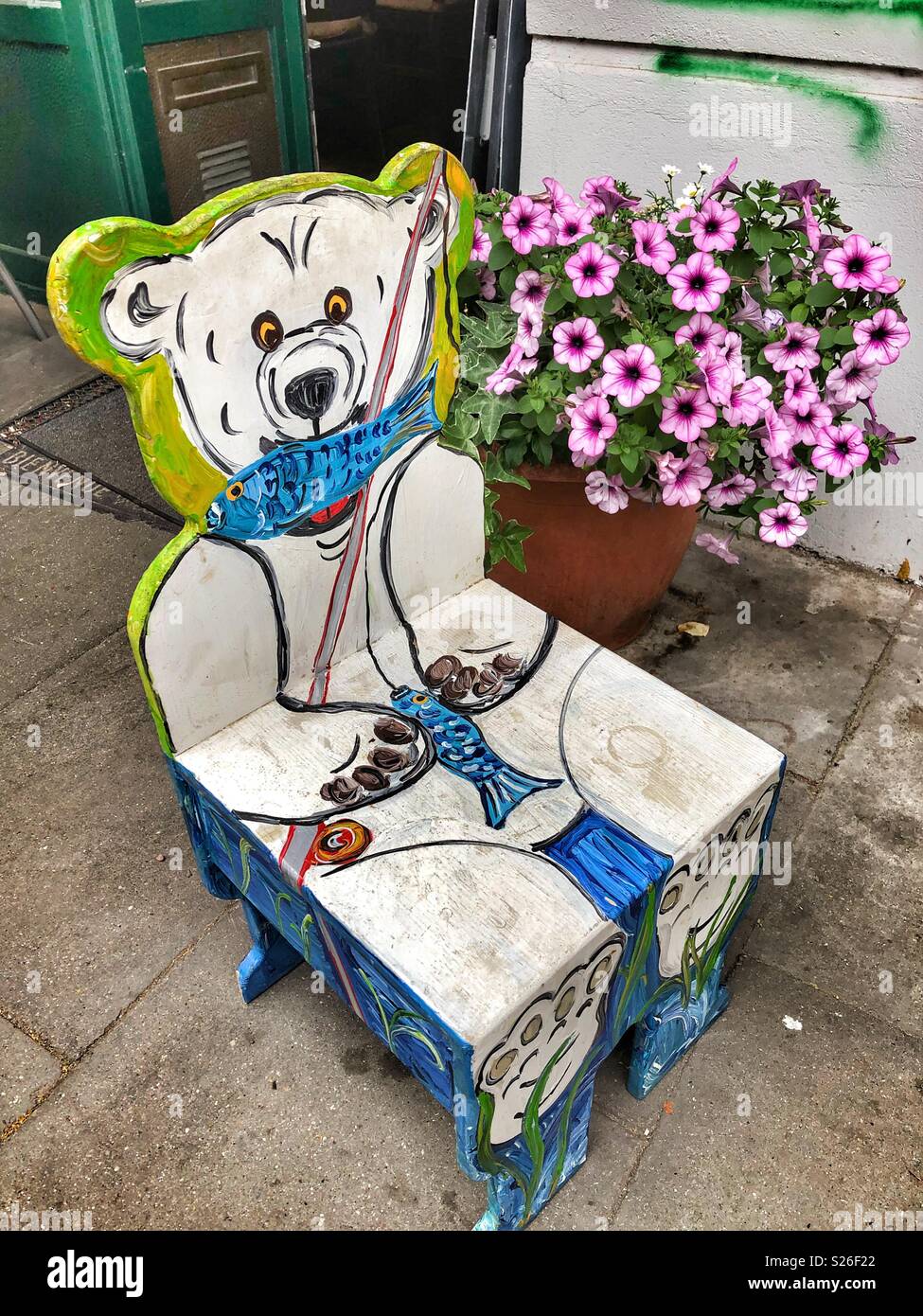A small wooden child’s chair painted as a polar bear. - Smartphone Captured Stock Image