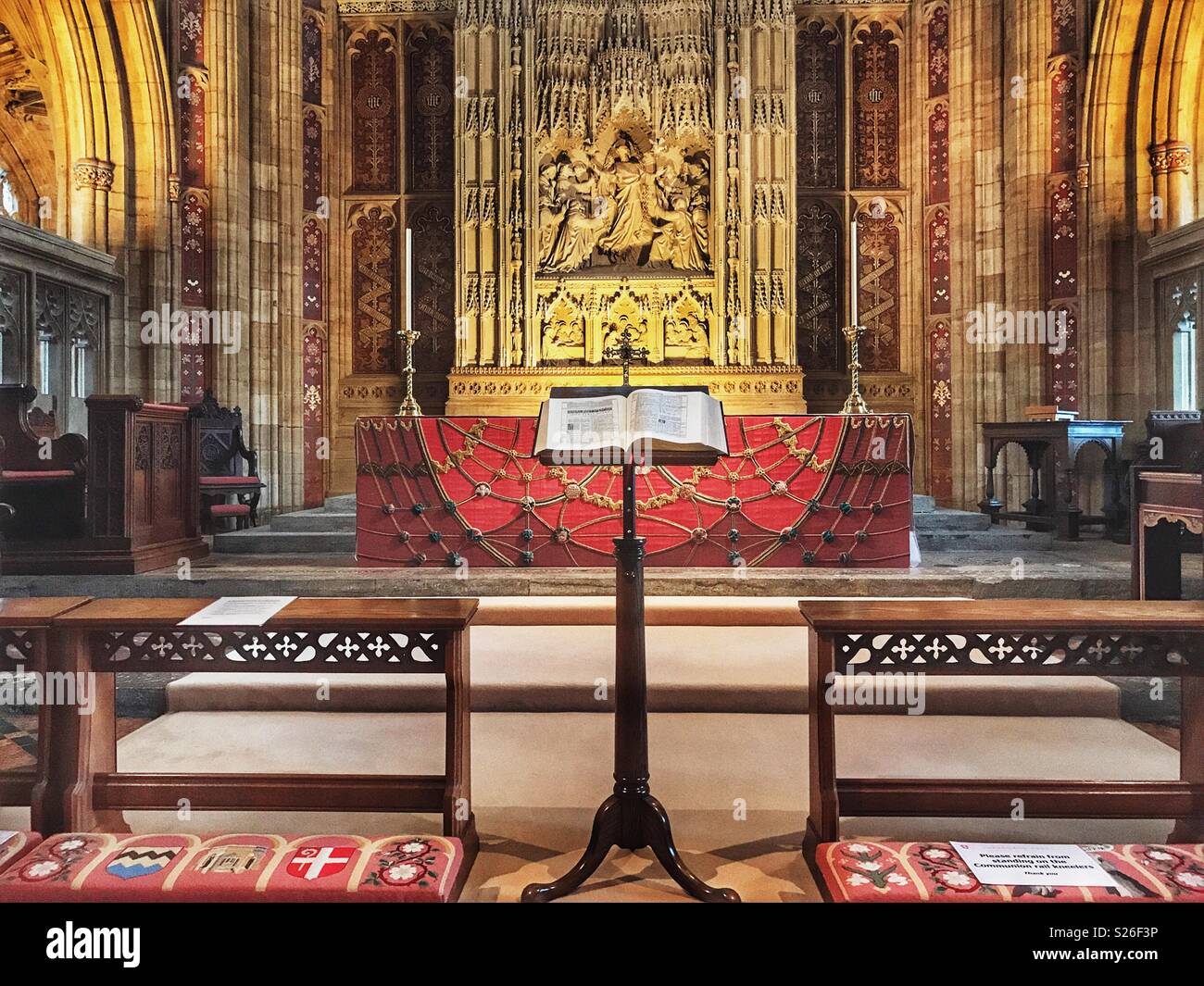 Bible on stand in front of the main altar of the magnificent Sherborne Abbey, Sherborne, Dorset, England - Smartphone Captured Stock Image
