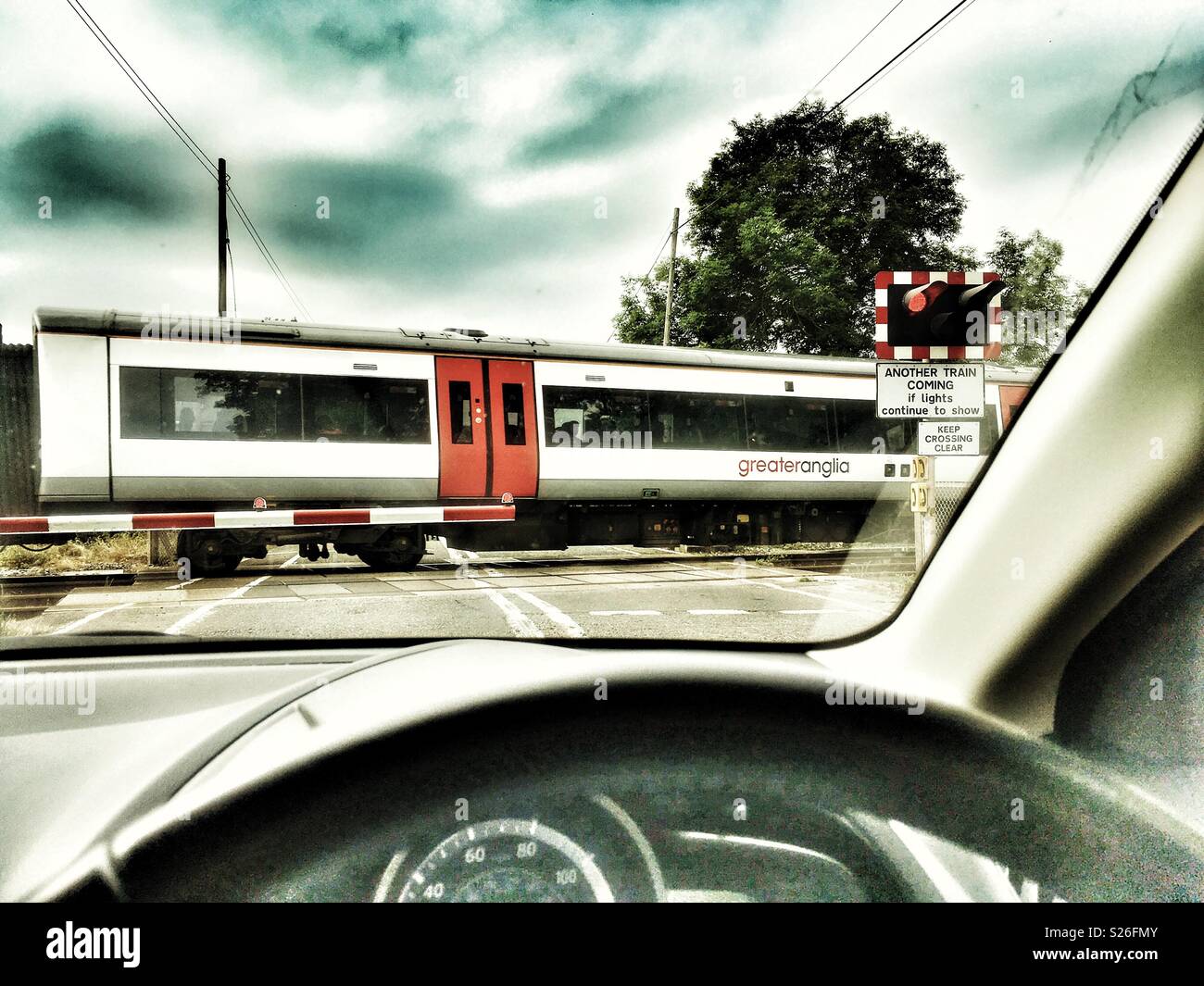 GreaterAnglia London to Lowestoft train passing through Yoxford on the East Suffolk branch line. - Smartphone Captured Stock Image