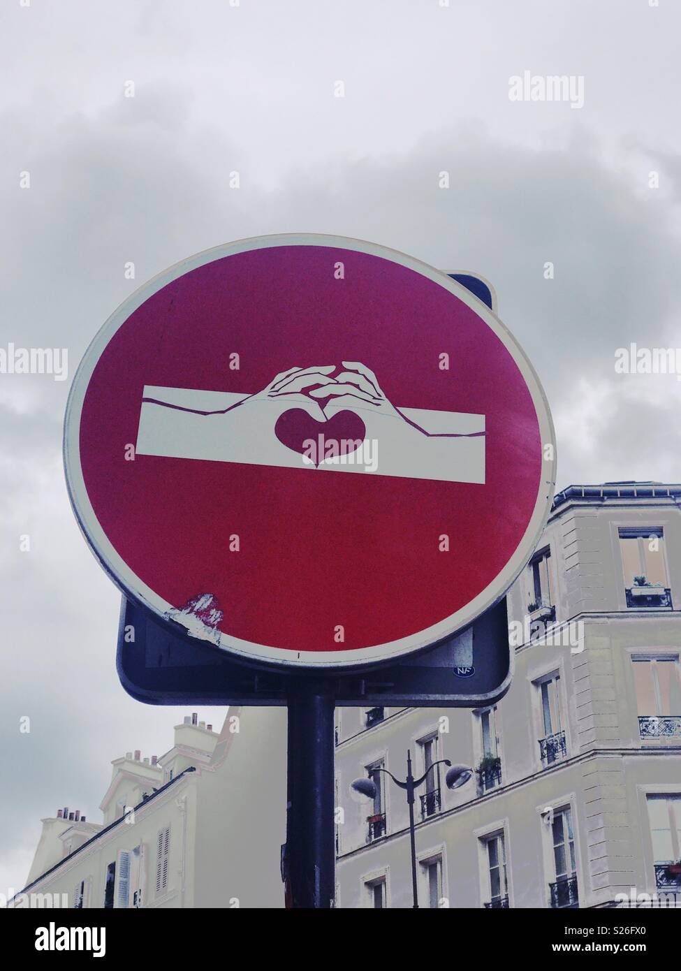 Paris. Converted Road sign to hands and a heart shape - Smartphone Captured Stock Image