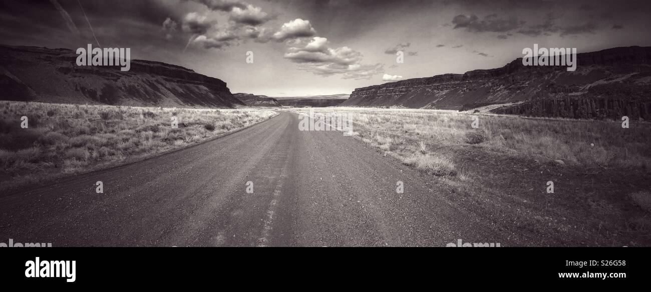 Lonely road crosses Moses Coulee in Eastern Washington, USA Stock Photo