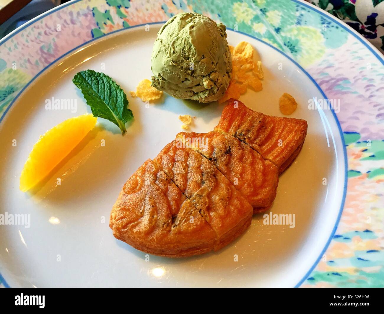Taiyaki, Green tea ice cream and mango served for dessert at a luxury Japanese restaurant, New York City, USA - Smartphone Captured Stock Image