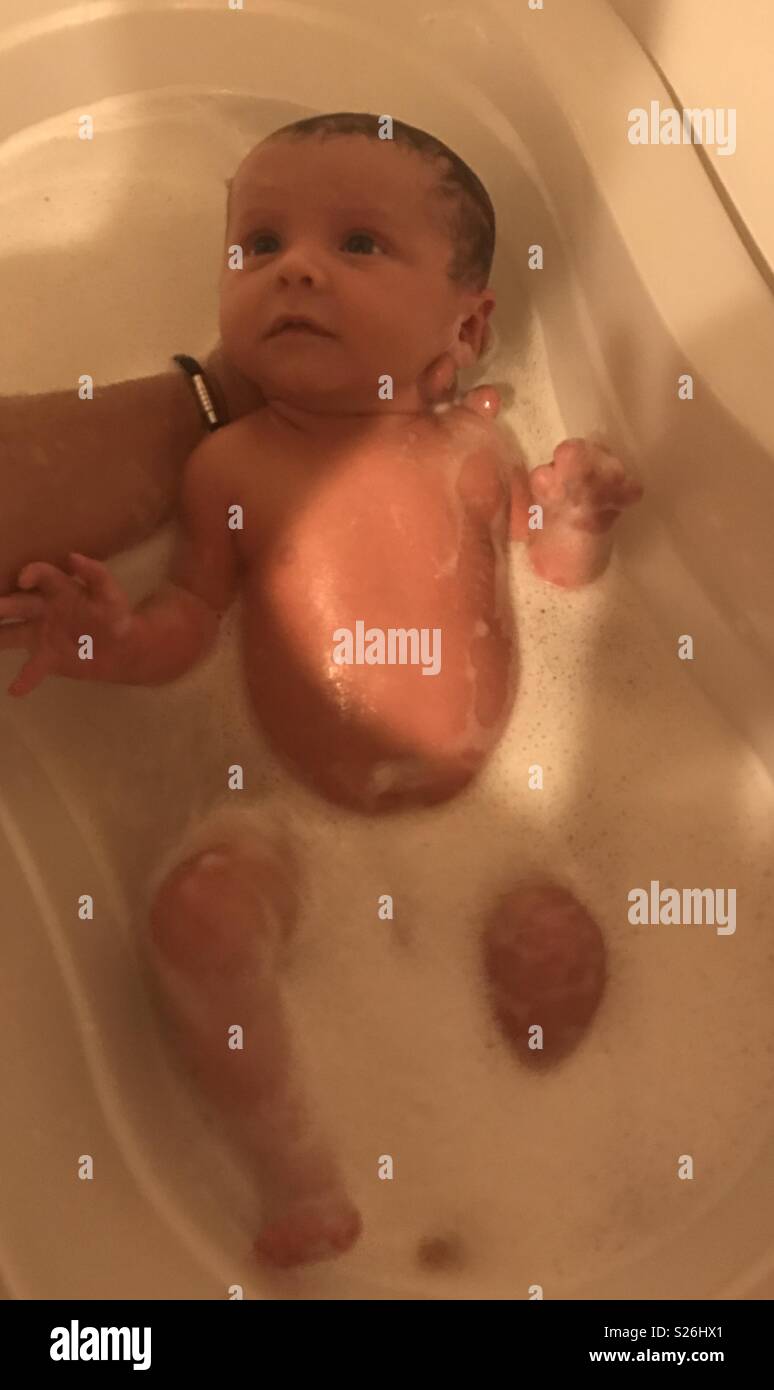 Newborn bath time Stock Photo - Alamy