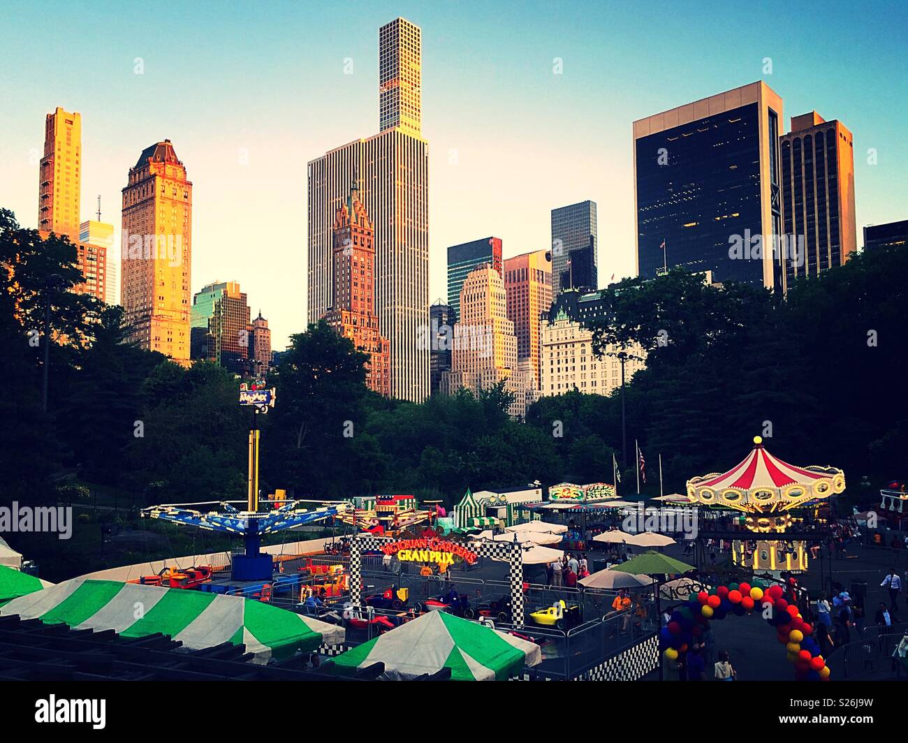 Victorian gardens carnival is an amusement park in the southern part of central park during the summer, NYC, USA - Smartphone Captured Stock Image