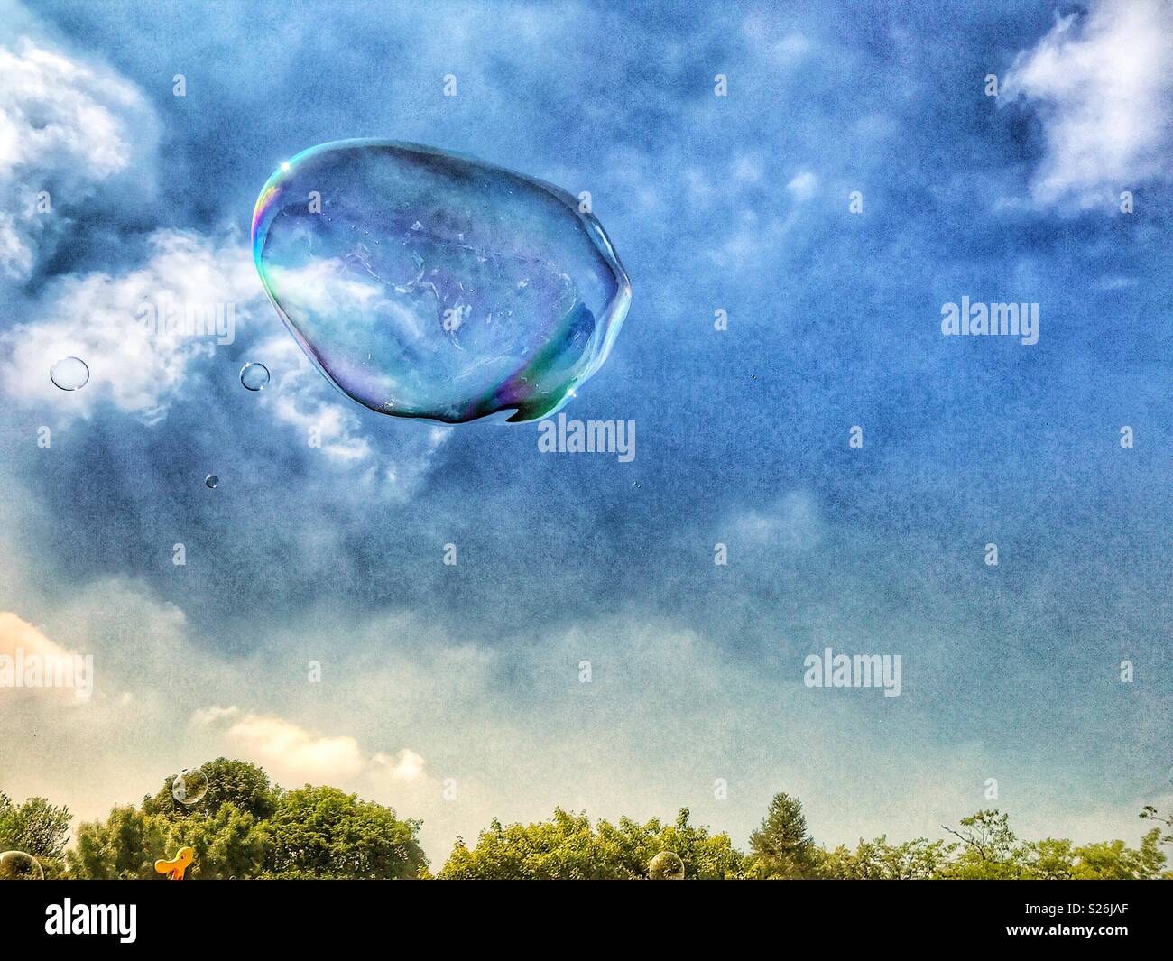 Huge soap bubble, floating in the sky Stock Photo - Alamy