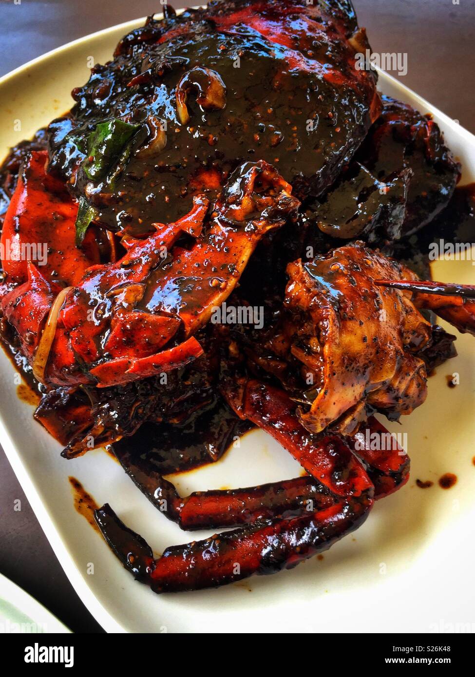 Black pepper crab at East Coast Lagoon Food Village, a hawker food market in Singapore Stock