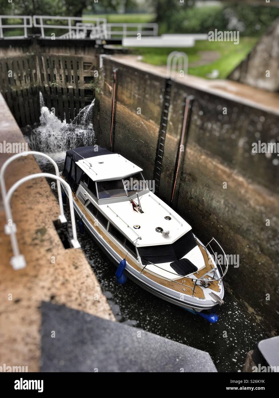 A Princess 32 river boat in a canal lock at Milby near Boroughbridge North Yorkshire - Smartphone Captured Stock Image